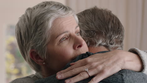 sad mature woman hugging husband sharing bad news to emotional wife couple embracing stressful retirement marriage problems 4k footage