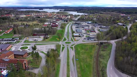 reversed dolly over traffic intersection with roads and a roundabout