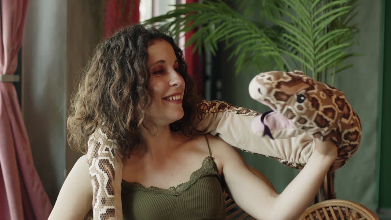 Woman interacting with a toy snake