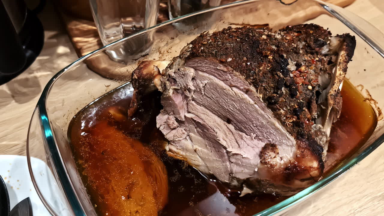 Oven roasted pork meat joint with spices cooked homemade meal salt pepper condiments