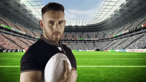 serious rugby player holds rugby ball