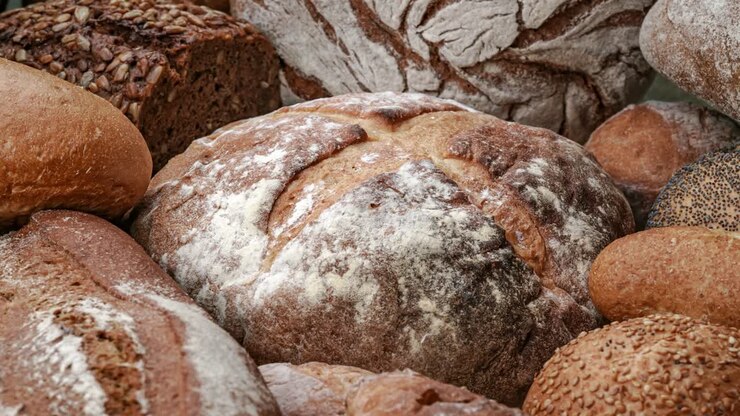 Freshly baked natural bread is on the kitchen table.