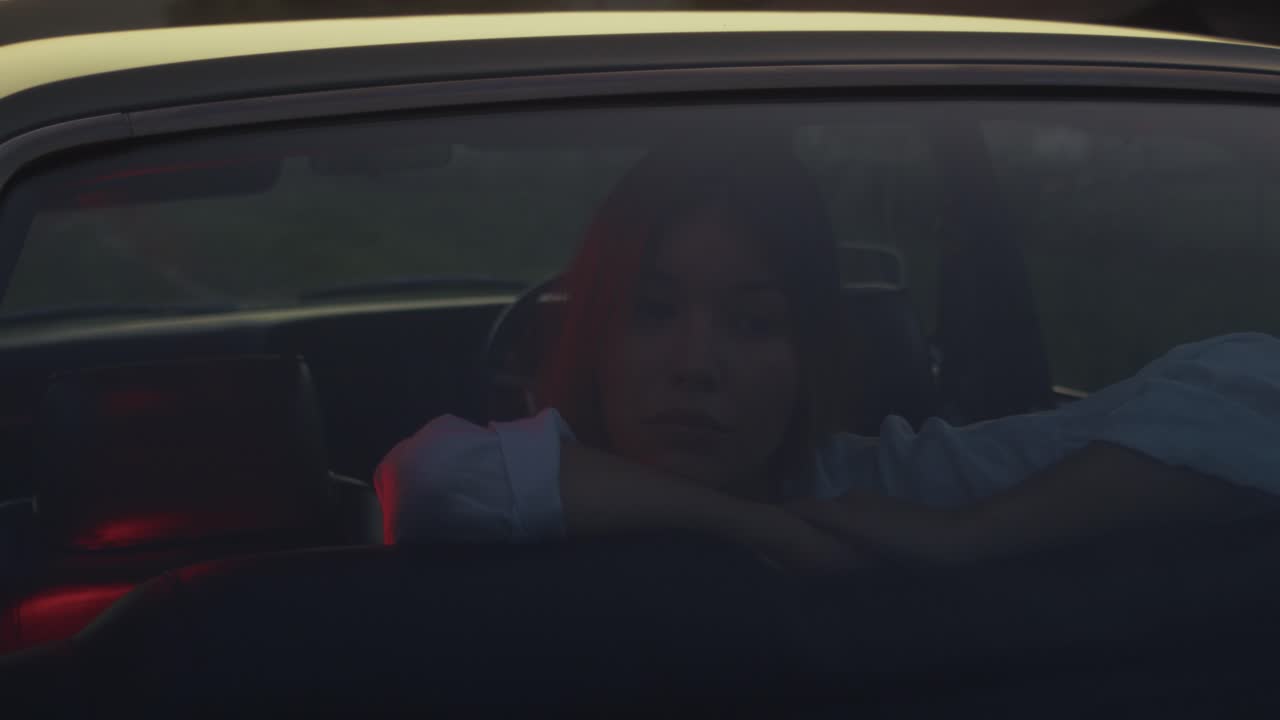 Woman Driving at Sunset