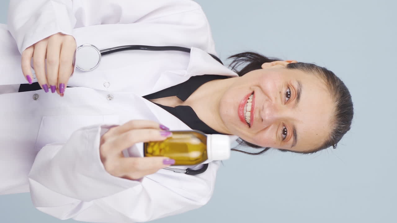 의사의 수직 비디오는 약물의 사용을 설명합니다.
