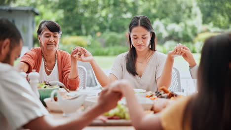 food, love and family holding hands in prayer