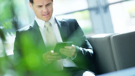 portrait caucasian banking finance executive using tablet technology
