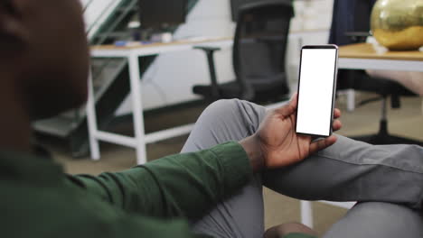 african american businessman using smartphone for video call with copy space