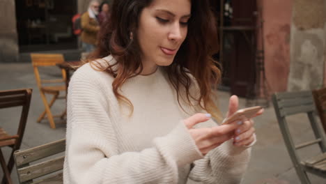 Brunette-woman-taking-photo-with-her-smartphone