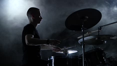 silhouette of drummer on stage