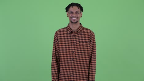happy young handsome african man with dreadlocks