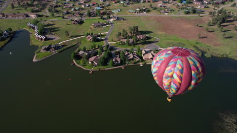 aerial view of hot air balloon flying above pagosa springs, colorado usa, drone shot