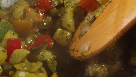 sautéing assorted vegetables in a pan