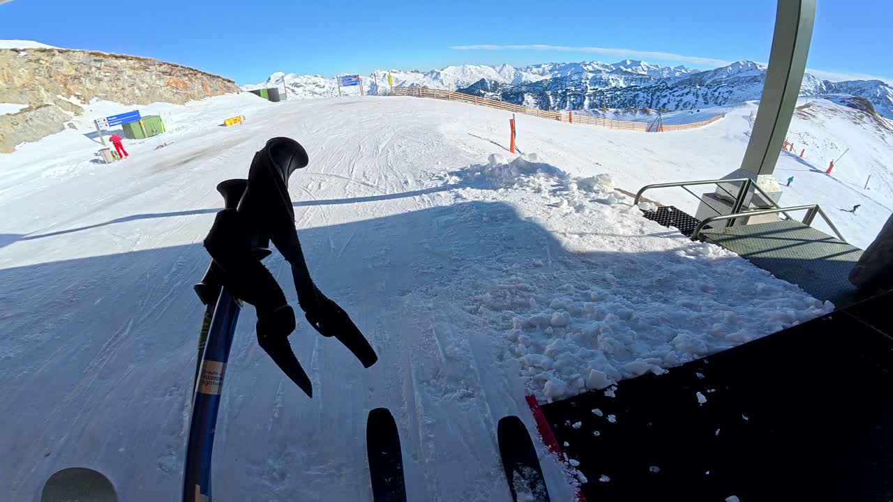 Skiing on Snowy Mountains on a Sunny Winter Day