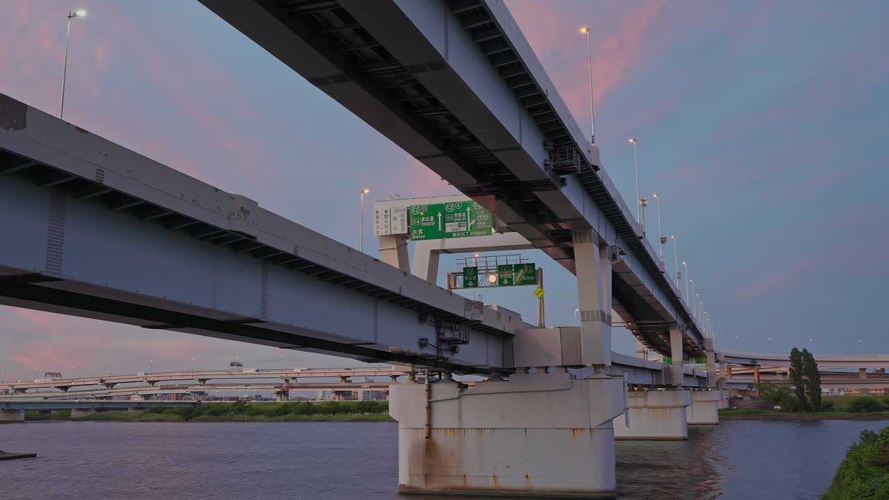 A night view of the intricate Horikiri Junction with streaks of light from flowing traffic on the expressway