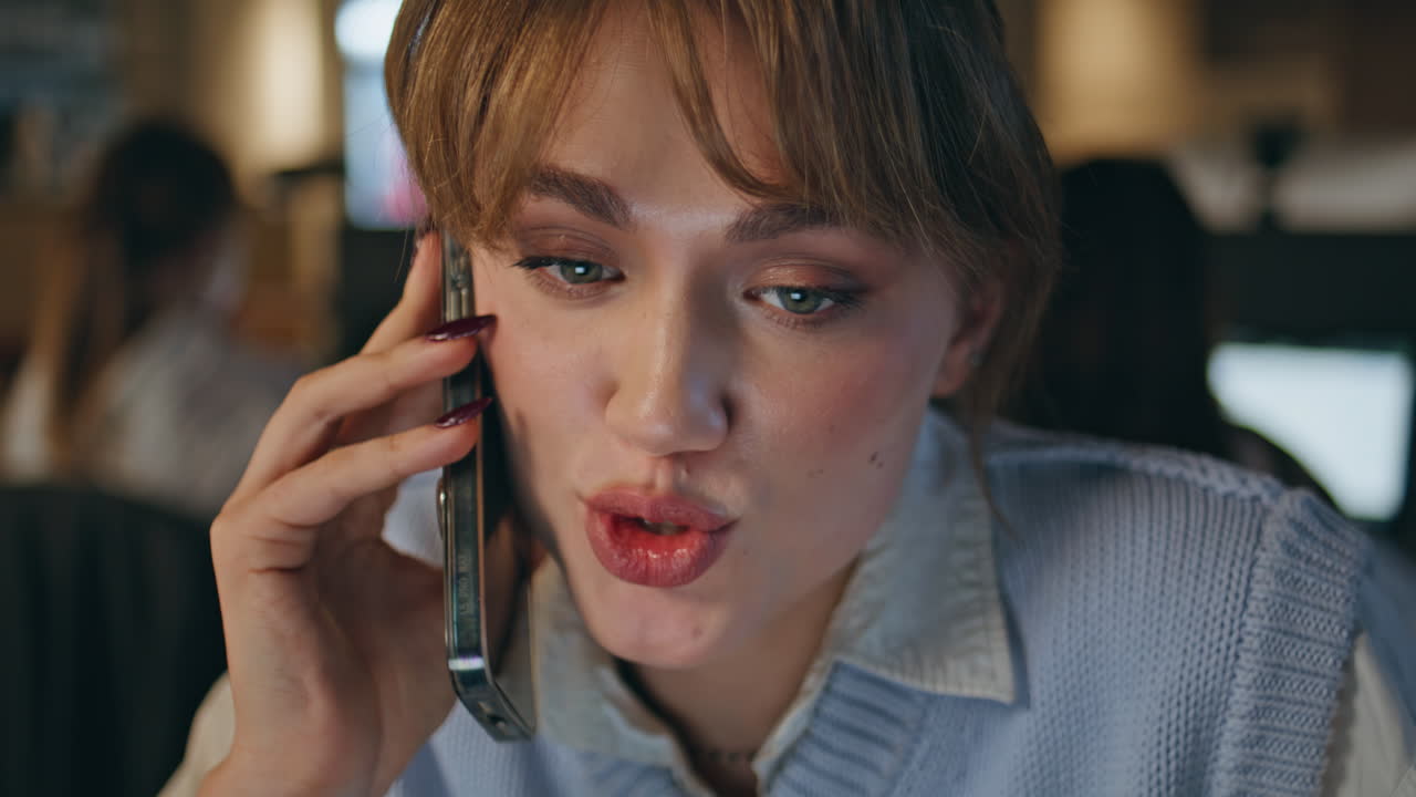 Late secretary talking mobile phone in modern office closeup. Woman having call