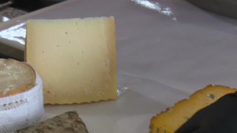 preparing and cutting aged cheese