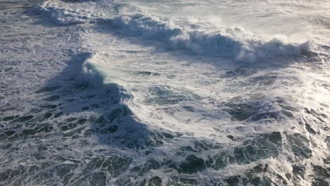 sea surface of the ocean with waves crashing into each other