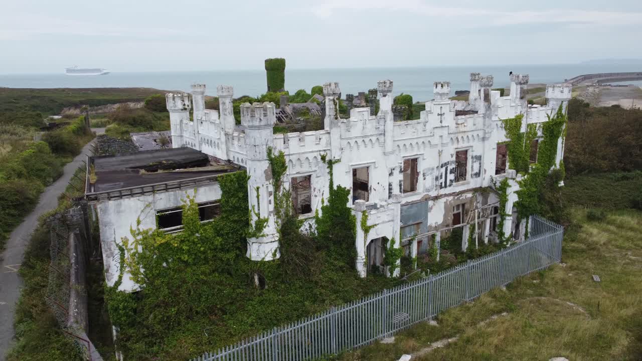 Soldiers point house aerial view establishing abandoned ruins of hotel castle coastal mansion