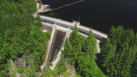 aerial view of water flowing down a spillway on a hydroelectric dam