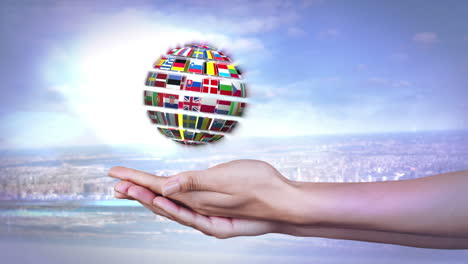 ball made of european nationals flags turning on hands