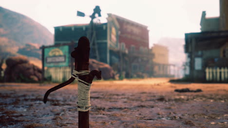 western town in the desert landscape with rustic buildings and dirt road