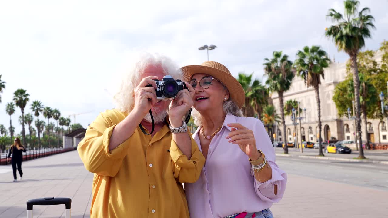 Senior Couple Enjoying Vacation and Taking Pictures