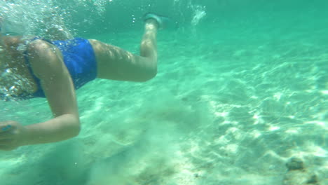 woman using pad to make underwater shot