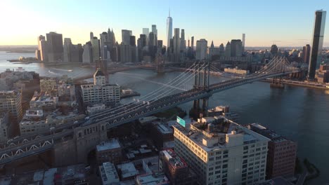 Very-Good-Aerial-Over-Lower-Manhattan-New-York,-Brooklyn-Bridge,-Manhattan-Bridge-And-East-River