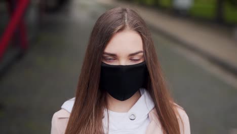 girl in a mask portrait on the street soft light