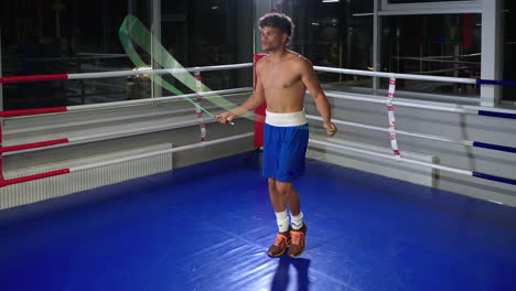 man jumping rope in boxing ring