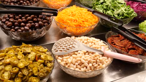 a salad bar with a variety of fresh ingredients