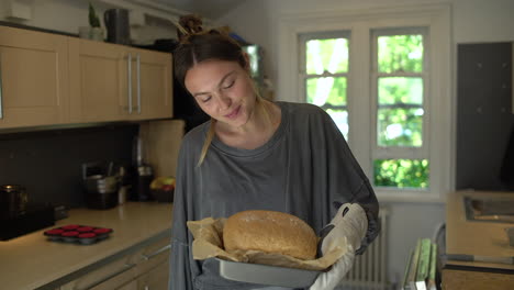 Young-Woman-Proud-of-Freshly-Baked-Bread-Loaf