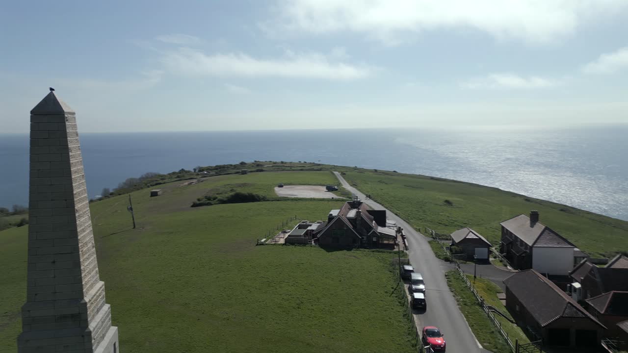 Cinematic drone orbit around Earl of Yarborough Monument near coastal homes