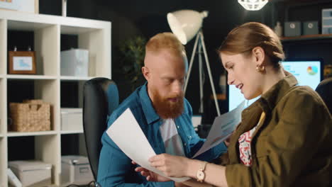 amazed business couple checking documents in stylish interior.