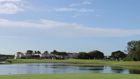 peaceful view of homes by a calm lake