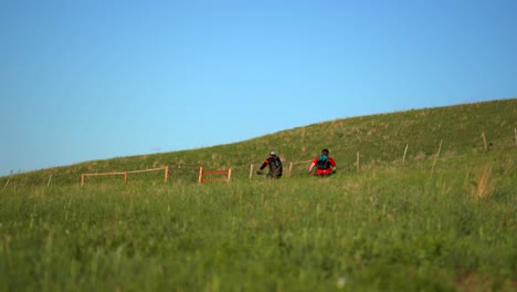 Mountain-bikers-riding-in-a-trail