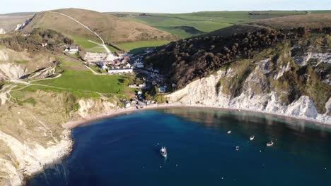 sunny aerial view across lulworth cove in dorset