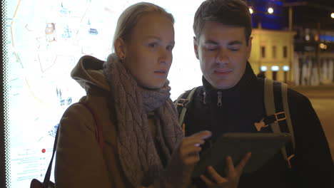 tourists walking in tallinn with tablet