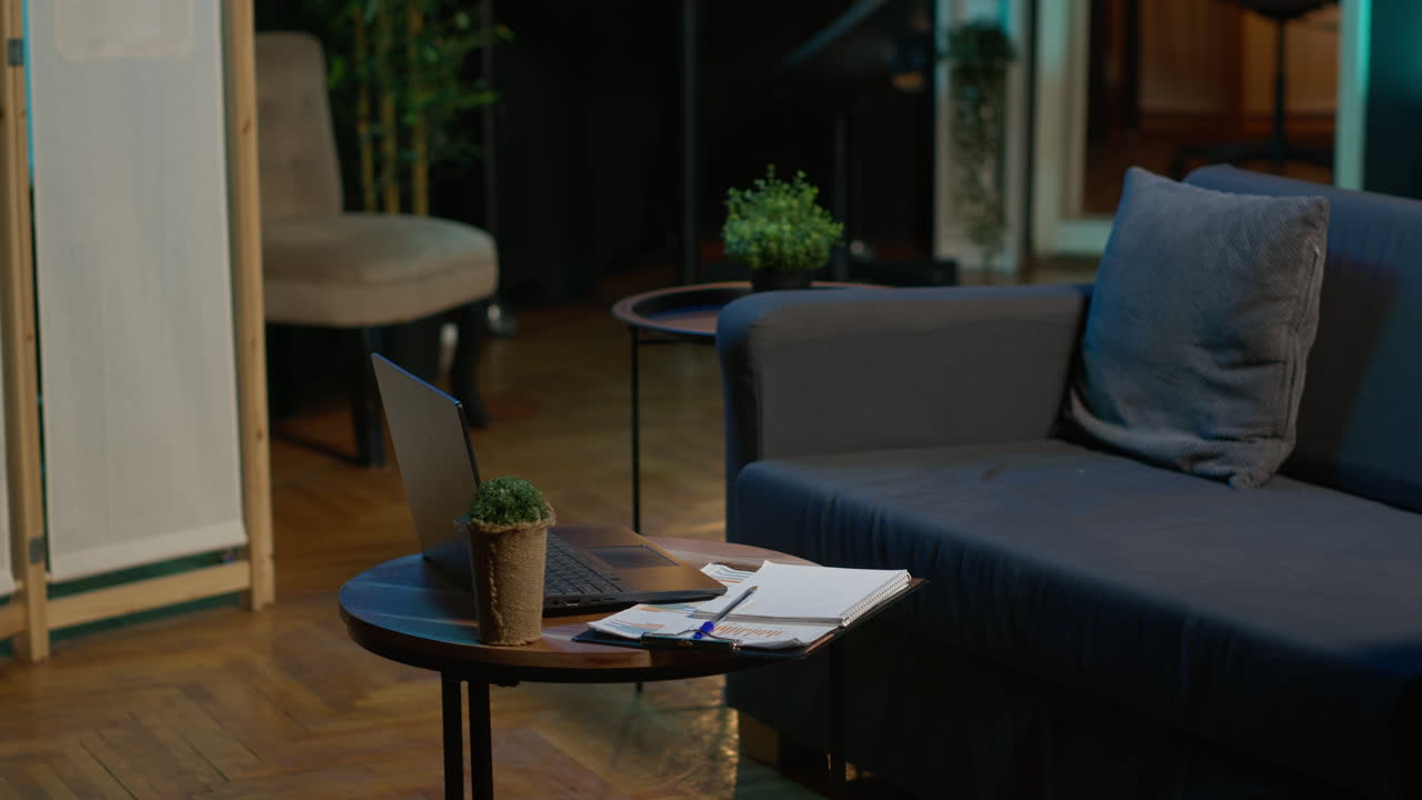 Modern stylish loft apartment with neon lights and trendy decorations, indoor plants and a smart tv setup for a young adult living alone. Minimalist casual space with cool furniture.