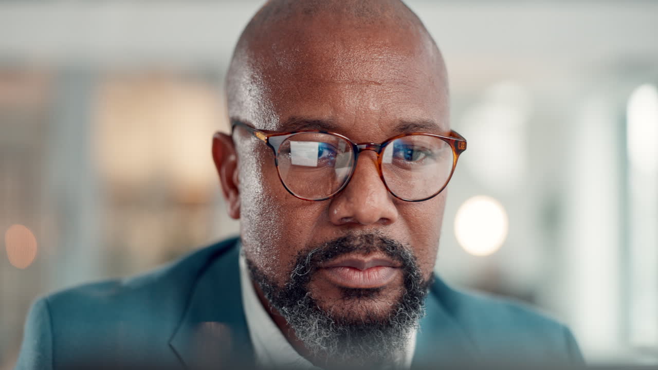 Close-up portrait of a man with glasses