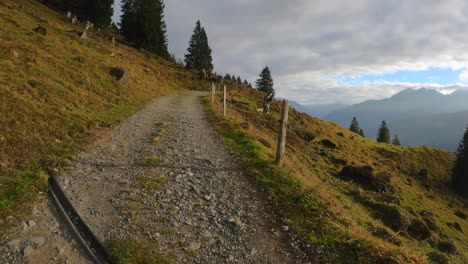 POV-shot-of-a-hiking-trail-in-the-mountains