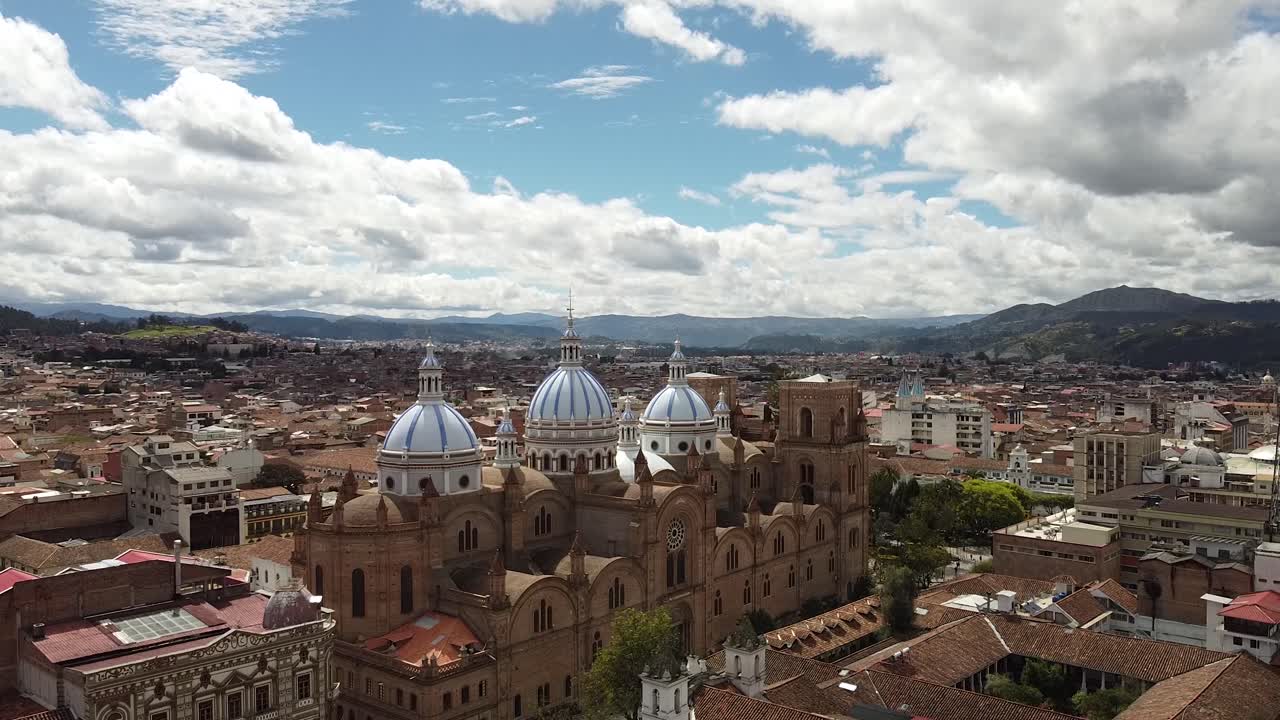 Aerial reveal of cathedral in Cuenca Ecuador. Catedral de la Inmaculada Concexpción. Cathedral of Immaculate Conception in Cuenca Ecuador.