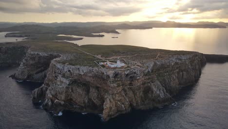 Lighthouse-at-sunset-on-coastal-cliff-top-in-Menorca-Spain