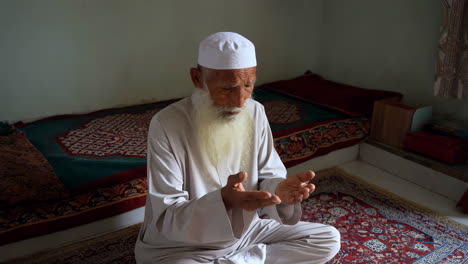 an old muslim man praying