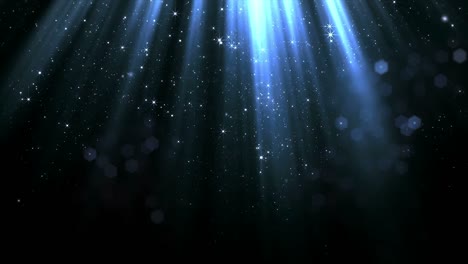 partículas que caen suavemente y el bokeh de la corriente de luz superior suave