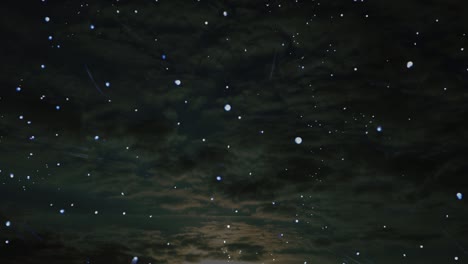 stars floating and twinkling on dark cloudscape background