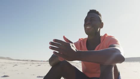 african american man sitting seaside