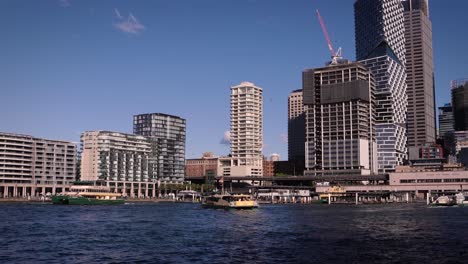 cityscape with ferries on a sunny day