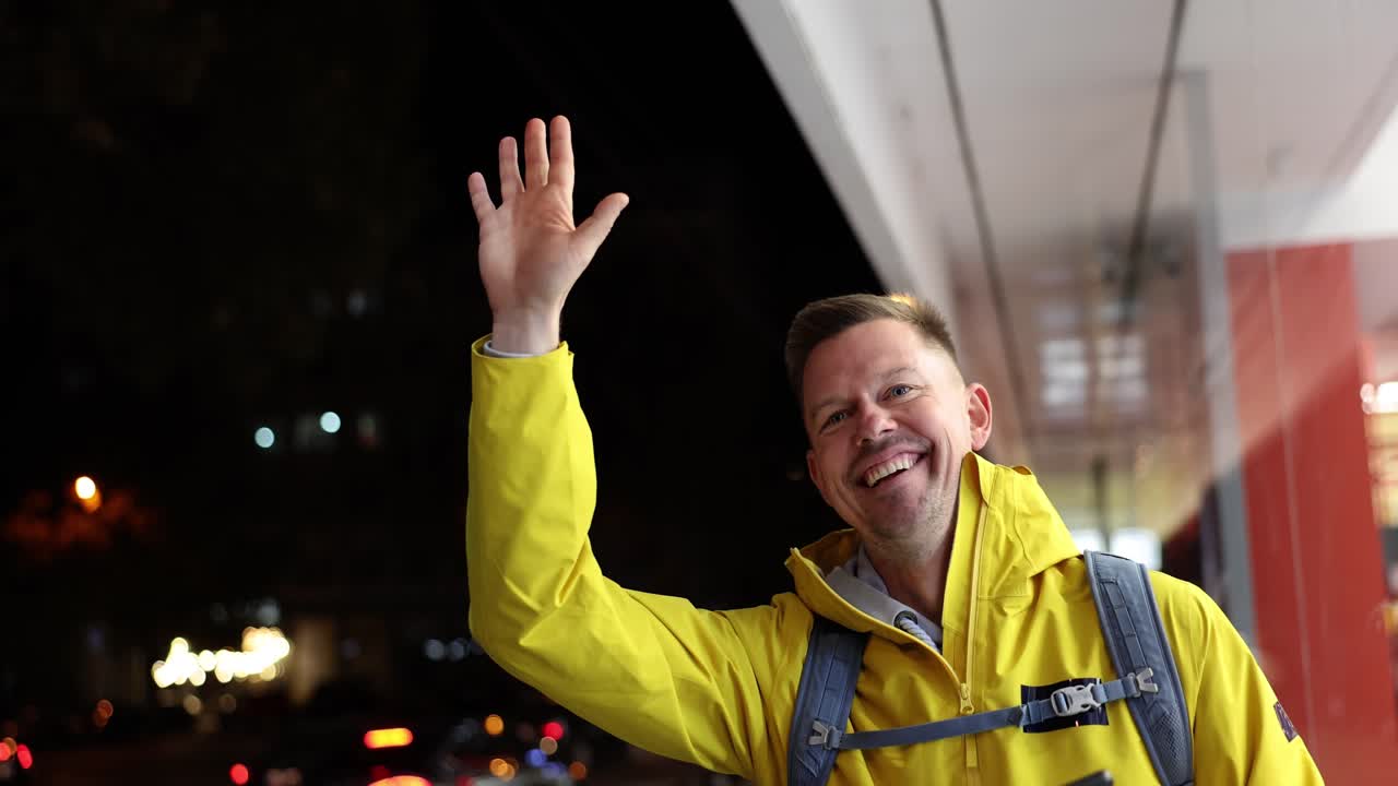Man in Yellow Jacket at Night