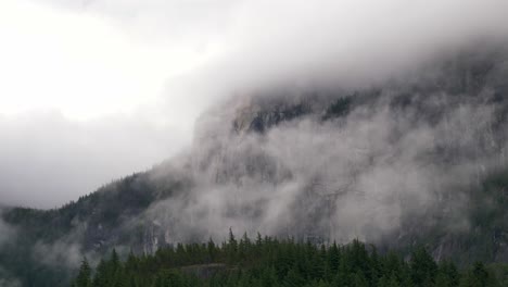 thechief, squamish, british columbia, canada - a breathtaking view of a foggy mountain - close up